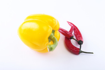 Assorted vegetables, fresh bell pepper and chilli pepper isolated on white background. Selective focus.