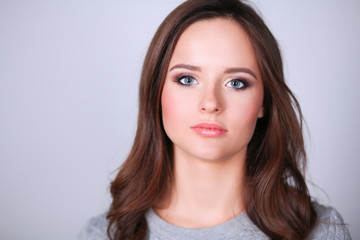 Fototapeta premium Portrait of an attractive fashionable young brunette woman