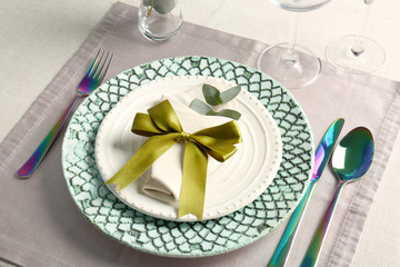 Beautiful table setting with silver flatware