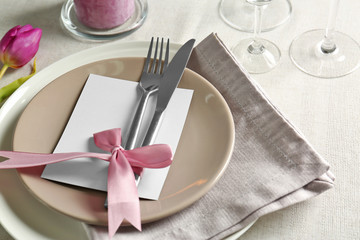 Beautiful table setting with silver flatware