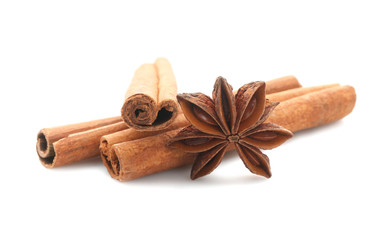 Cinnamon sticks and anise star isolated on white, closeup