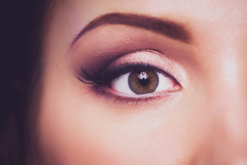 Close up view of woman eye with makeup