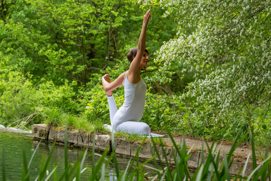 Girl in white doing yoga