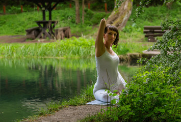 Girl in white doing yoga