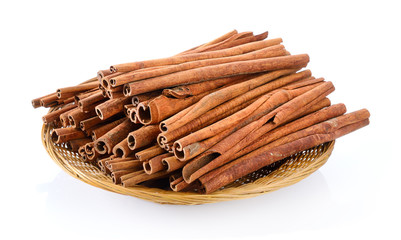 Cinnamon in basket on white background