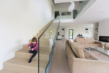 family with little girl enjoys in the modern living room