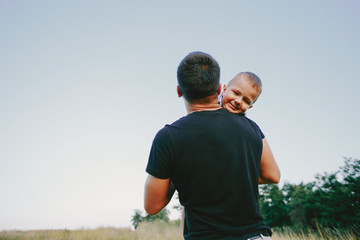 Naklejka premium young family with a child have fun outdoors