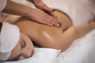 Fototapeta na wymiar woman receiving a back massage