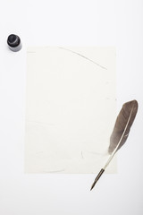 A fountain pen with ink, letter on the white table.