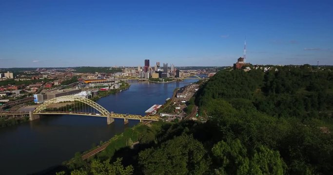 PITTSBURGH - Circa May, 2017 - An early evening slowly moving forward aerial view of the Pittsburgh, PA skyline as seen from the West End Overlook.	 	