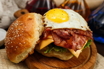 Bacon burger with beef patty and egg yolk