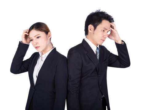 Worried business man and woman isolated on white
