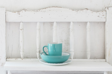 Fototapeta na wymiar dinnerware on white wooden shelf