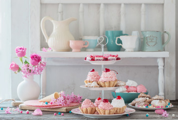 pink cakes on plate on white background