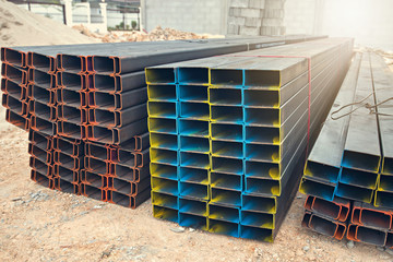 Stainless steel rectangular bars of meta on new construction site.