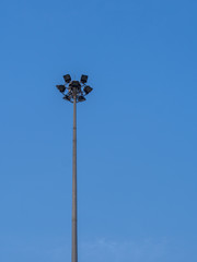 A Light poll with clear blue sky at public side