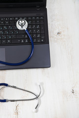 Health care concept. Stethoscope on a laptop