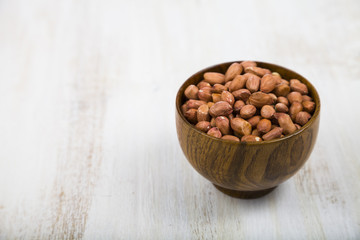Peanuts in a wooden bowl