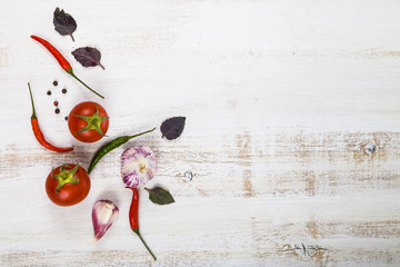 Vegetables and spices in a wooden table.