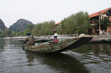 Fototapeta na wymiar Passenger Boat near river Cliff 