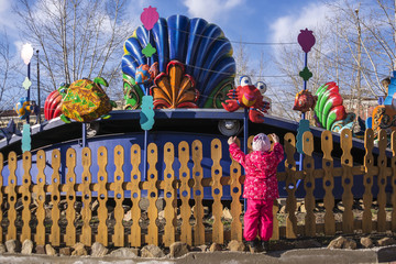 Little girl in amusement Park. She wants to get on the rides.