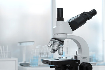 Laboratory lens of Microscope Isolated blue scientific research background.