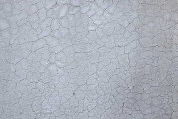 Grunge concrete cement wall with crack in industrial building, texture background.