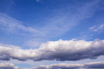 White clouds in the beautiful blue sky. Background from clouds.