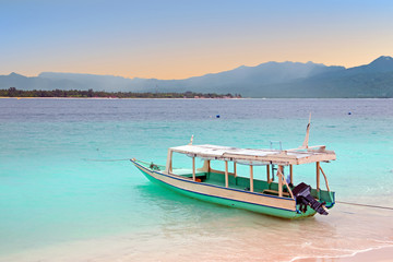 Traditional boat on Gili Meno island beach, Indonesia at sunrise © Nataraj