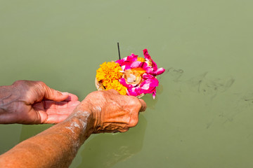 Doing puja at the river Ganges in India