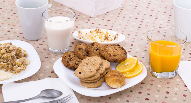 still life of juice, milk, biscuits, porridge from cereals