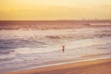 Obraz premium The Joy of the Ocean Experienced by a Girl