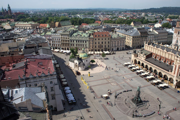Aerial view of the south-western part of the Main Market Square of Krakow with Church of St. Adalbert and part of Cloth Hall called Sukiennice, and other old buildings.
