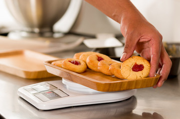 preparing delicious christmas cookies in a bakery store