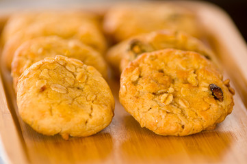 Freshly baked chocolate chip cookies on tray rack