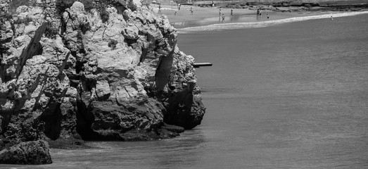 Diving board on a cliff with ocean in background in Cascais Portugal