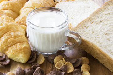 Breakfast with milk and  bread.