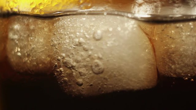 air bubbles in the ice cubes in cola