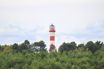 Fototapeta na wymiar Lighthouse in Nida, Lithuania. Nida Lighthouse is located in Nida