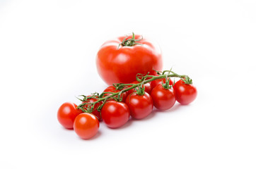 Composition of small cherry and large tomato. Isolated