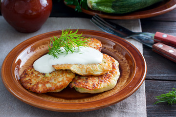 Freshly cooked fried fritters from zucchini and cottage cheese, horizontal