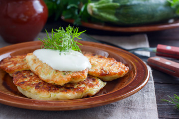 Freshly cooked fried fritters from zucchini and cottage cheese, horizontal