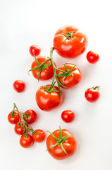 Composition of small cherry and large tomato. Isolated