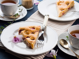 Strawberry pie from mixed flour. Spring summer still life. Sweet food festive treat