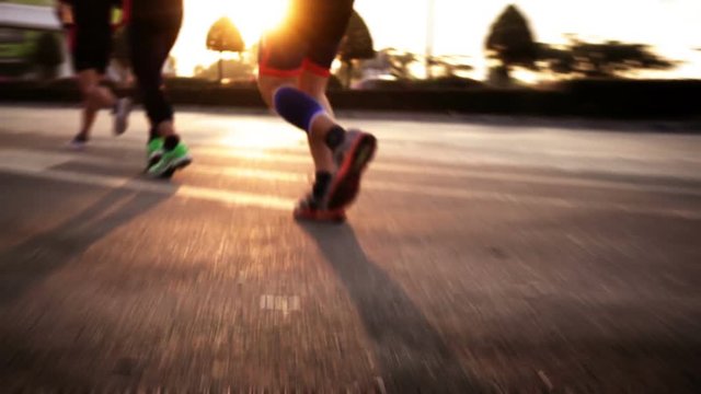 Motion blur of runner person running on roadway in the morning, slow motion high definition video