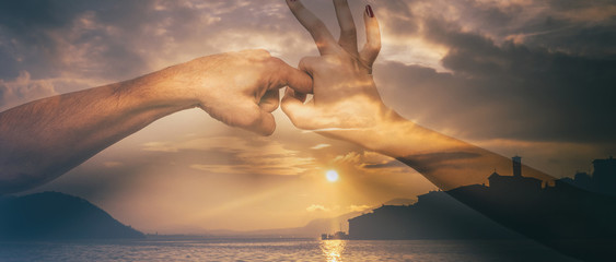 Double exposure of sex gesture and beautiful lake at sunset, letterbox