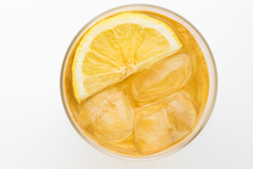 Glass of lemon ice tea isolated on white background. From top view