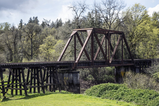 Iron Wood Railroad Trestle Train Tracks Bridge Canopy, Green Lush Trees Grass Vegitation, Blue Sky White Clouds, Picturesque , Americana, Daytime - Oregon USA (HDR Image)