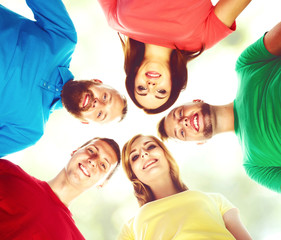 Group of smiling friends standing together. College, education, university: concept.