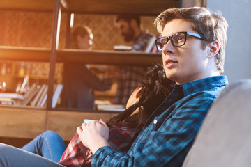couple resting on couch